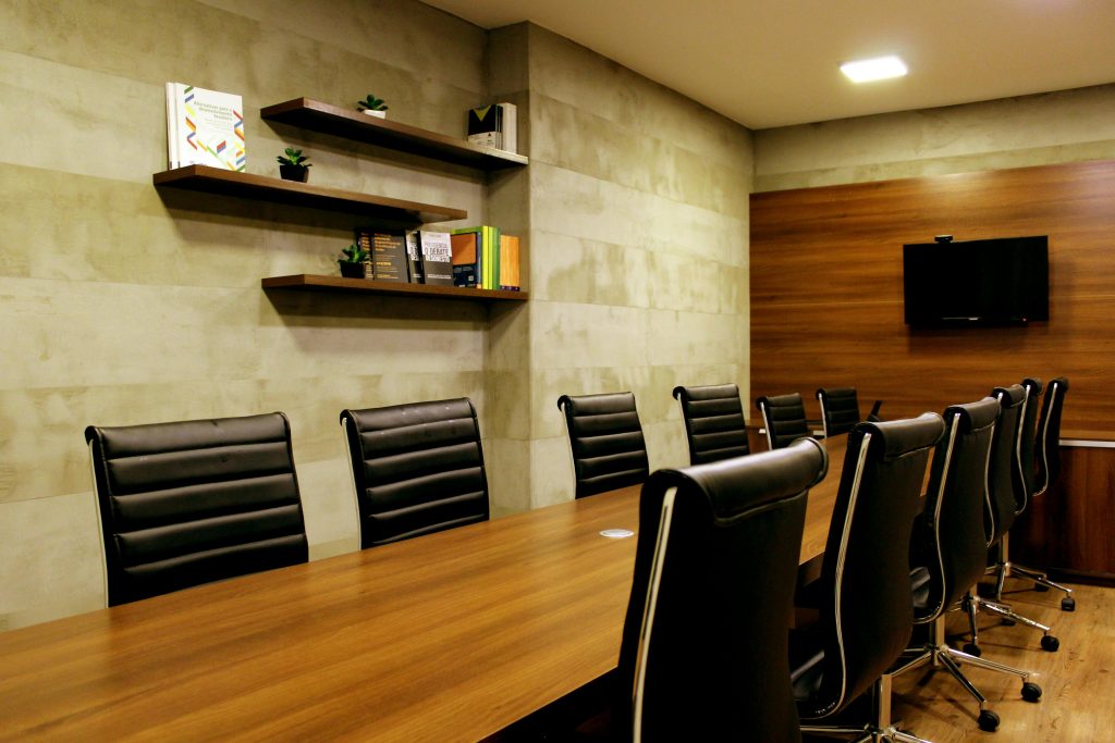 pexels-photo-2976970-2976970 Elegant boardroom with leather chairs and wooden decor, ideal for meetings.